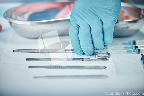 Image of Surgery, tools and doctor hand with health, glove for safety and protection with medical equipment zoom. Surgeon, organize and cardiology healthcare, ready for cardiovascular surgical procedure.