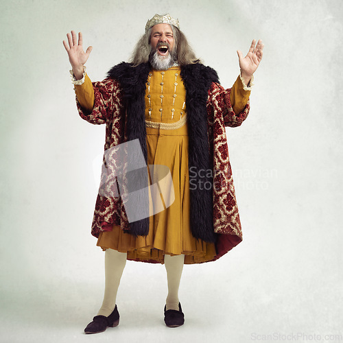 Image of Ancient king man, screaming and studio with laugh, funny and renaissance fashion by backdrop. Medieval royal leader, clothes and laughing with crown, happiness and robe for power, success and luxury