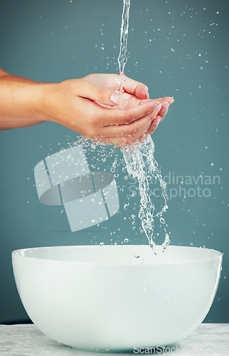 Image of Woman hands, sink and water for washing, skincare hygiene and beauty isolated on studio background. Splash, liquid and cleaning body with bath, natural cosmetics for skin and health with wellness