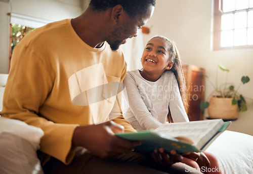 Image of Father, child and book for story time on bed with smile enjoying reading or listening and bonding together at home. Happy dad and daughter sitting with textbook for learning or education in bedroom