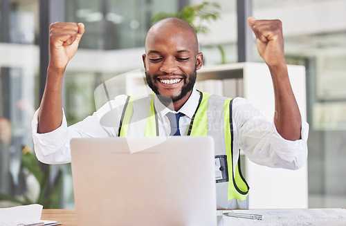 Image of Construction engineer man, laptop and celebration in office for success, contract and happy for email communication. Black man, engineering and construction worker with winning bonus, goal and profit