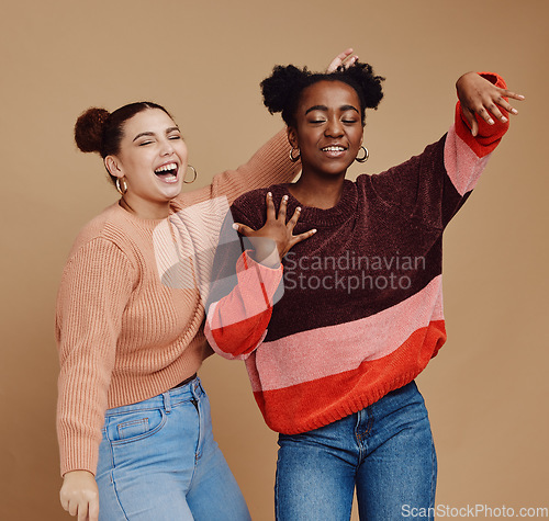 Image of Fashion, friends and dance with teen girl, young and trendy with gen z style, fun and freedom against studio background. Laugh, funny and dancing with stylish youth, happy with energy and marketing