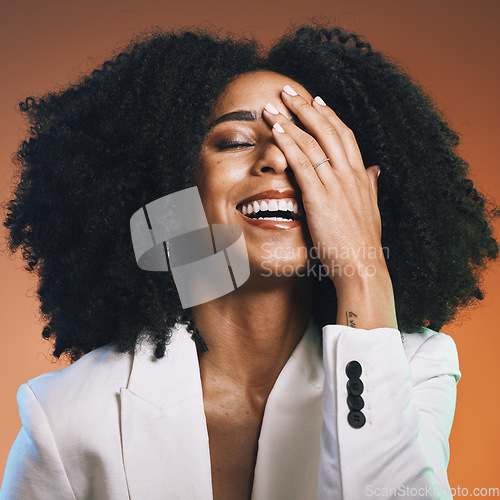 Image of Happy black woman, face and hand with hair and beauty, manicure and hair care with afro against studio background. Funny, pride and cosmetic skincare, facial and natural curly hair texture with laugh