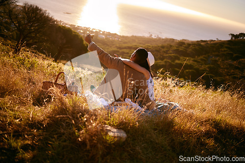 Image of Selfie, sunset and couple on a picnic in the mountains for a date, anniversary or bonding in Costa Rica. Nature, phone photo and man and woman in a field for a honeymoon and mobile communication