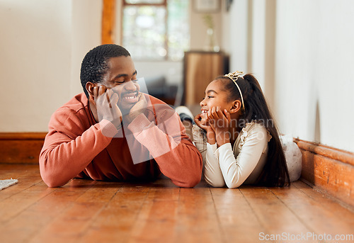 Image of Relax, black family and father with daughter on floor, happy and bonding in their home. Love, parent and girl lying together, enjoying conversation, relationship and sweet moment indoors