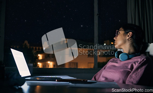 Image of Woman thinking at night, student and laptop for test, distracted girl and notes for exams. Female, lady and academic with pc, dark or planning for task, essay or online reading for education or study