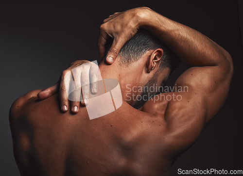 Image of Bodybuilder man, studio and back muscle with hands, wellness and touch for self love, growth or health. Model, strong body and fitness with self care, stretching and flex for goal, vision and beauty