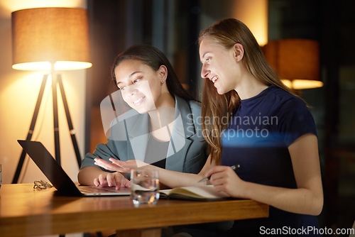 Image of Business people, laptop and discussion at night in office planning strategy, report deadline and overtime training. Business women talking, late meeting and tech marketing leaders at workplace desk