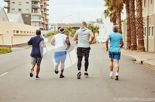 Image of Fitness, running and teamwork with friends in city for stamina, cardio and endurance training. Sports, jogging and community with group of runner sprinting in town for workout, exercise and health