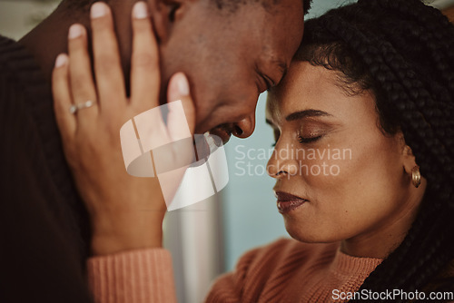 Image of Black couple, home and love while happy together within a marriage with commitment, happiness and care. Face of man and woman with trust and support while in kitchen to bond in a house or apartment