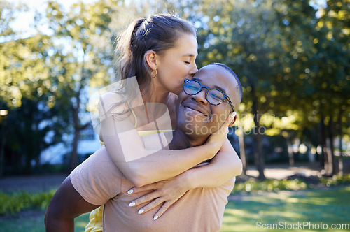 Image of Interracial, piggy back and couple in park, happiness and bonding for romance, loving and smile. Romantic, black man and woman on back, nature and love for relationship, dating and playful together