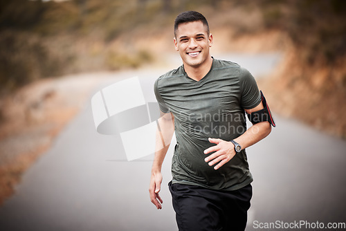 Image of Running, fitness and man in road portrait for exercise, training and workout with lose weight, muscle and energy. Happy runner, athlete or healthy person jogging for sports challenge in nature street