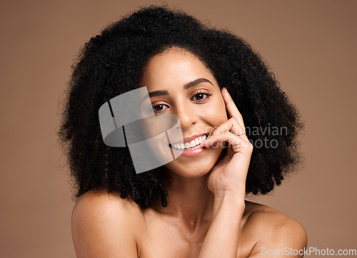 Image of Black woman, studio portrait and smile with beauty, makeup and cosmetic wellness with hands, face or natural hair. Model, soft skin and facial cosmetics, self care and afro by brown studio background