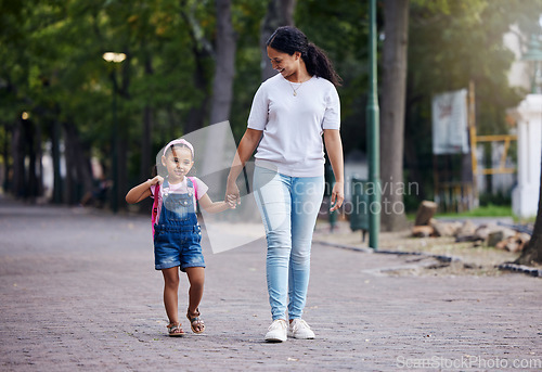 Image of Walking, park and mother holding hands with girl on journey for back to school, learning and class for first day. Love, black family and mom with child walk to kindergarten for education development