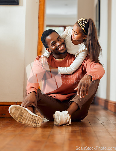 Image of Family, father and daughter hug in their home, happy and relax while bonding and having fun. Love, black man and girl with parent, smile and embrace, content and sitting on a floor together