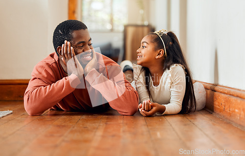 Image of Father, love and daughter relax on the floor, happy and bonding while talking in their home together. Black family, girl and parent enjoy conversation while lying, content and sweet on the weekend