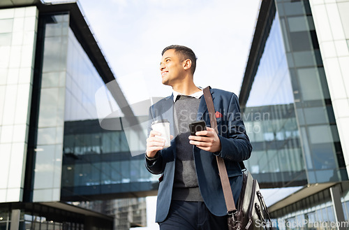 Image of Businessman outside building with phone, coffee and bag, happy waiting for online taxi service after work. Office, business and success, man with smile holding 5g smartphone standing on city street.