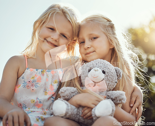 Image of Children, smile and teddy outdoor portrait with happiness, smile and bonding together. Freedom, happiness and smiling of a young girl with friend love and care in a park or garden feeling free