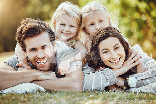 Image of Family, park and outdoor portrait of parents and girl children with love and care in nature. Mother, dad and kids with a smile in summer feeling happy on green grass bonding together on a picnic