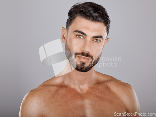 Image of Man, face with beauty and skin in portrait, muscle and glow with cosmetic skincare treatment against studio background. Grooming, hygiene and body care, clean with natural cosmetics and wellness