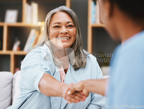 Image of Handshake, healthcare and appointment with a senior woman shaking hands with a female nurse in a retirement home. Thank you, medical and meeting with a mature patient and medicine professional