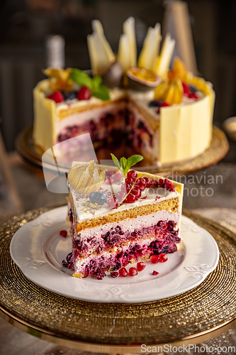 Image of Portion of layered creamy fruit cake