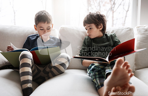 Image of Children, boys and reading books for education, learning or relax studying on house living room or home sofa. Kids, storytelling and fantasy fairytale novel in hobby activity or creative inspiration