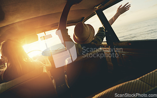 Image of Friends, women and sunset road trip at beach with car, hands and window in air for freedom, celebration or sea. Summer sunshine, vacation and ocean for driving, travel or nature by waves on adventure