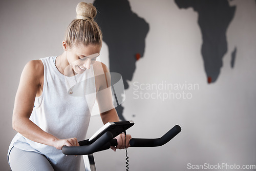 Image of Fitness, gym bike and woman cycling for cardio performance, body wellness and exercise mockup. Health goals, spin bicycle mock up or athlete girl happy for workout, sports training or power challenge
