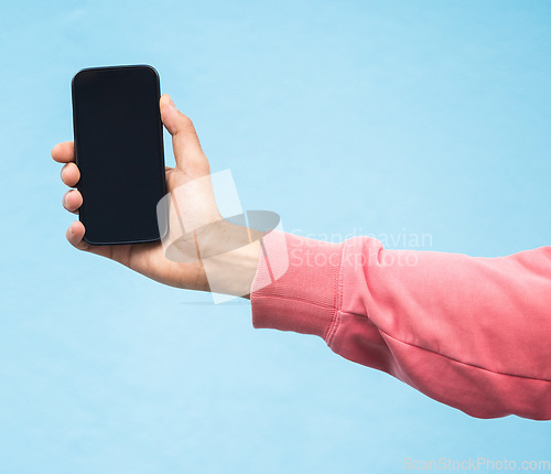 Image of Man, hand or phone screen mockup on isolated blue background in social media, app or blank web design. Zoom, student or model person with technology mock up for city contact communication or branding