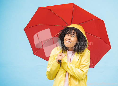 Image of Young african woman, umbrella and wall with smile, rain and fashion raincoat for safety, wellness or protection. Thinking gen z girl, winter or check sky for weather, walk or urban outdoor adventure