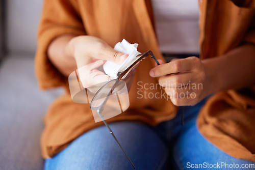 Image of Woman cleaning glasses for dust, dirt and eye care protection with fabric tissue. Closeup female hands, microfiber cloth and spectacles, frames and eyewear for clear vision and optic lens maintenance