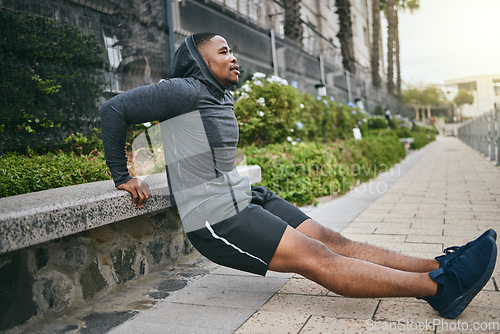 Image of Exercise, triceps dips and black man in city, street or outdoors. Sports, thinking and young male athlete exercising, training and workout for muscle, strength and health, power or body care in town.