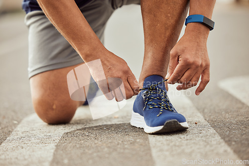 Image of Sports, fitness or hands tie shoes to start training, cardio workout or exercise in city road. Legs, man or healthy athlete runner with running shoes or footwear laces ready for body goals or race