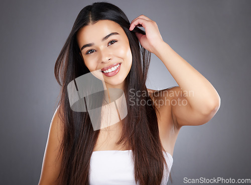Image of Hair care woman, smile and studio portrait for healthy cosmetic treatment, style and happy by backdrop. Model, hair health and natural shine with beauty, wellness and makeup glow by studio background