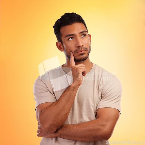 Image of Thinking, wondering and thoughtful Asian man with a choice isolated on a yellow background in a studio. Curious, think and Japanese person with a problem, thoughts or idea on a bright backdrop