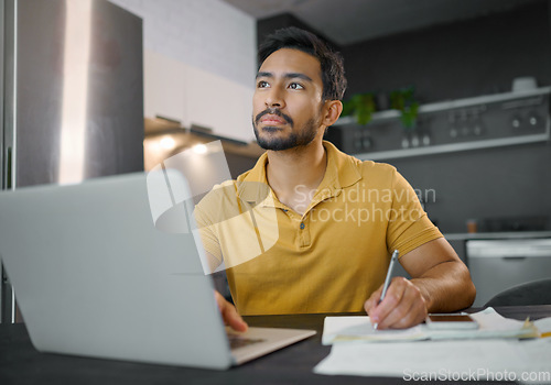 Image of Laptop, writing and thinking with a freelance man doing remote work from home on research in his small business startup. House, computer and notes with a male entrepreneur working in his house
