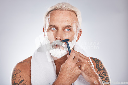 Image of Man, face or shaving foam grooming in self love maintenance, beauty aesthetic or gray studio background. Zoom, mature or model and hair removal cream, facial razor cleaning or hygiene skincare growth
