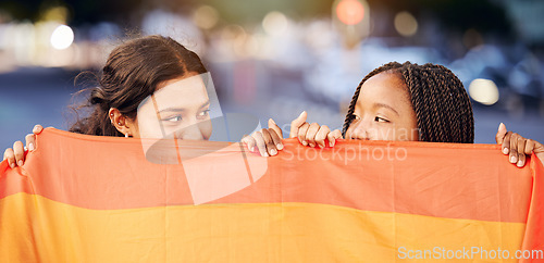 Image of Rainbow flag, LGBTQ and happy lesbian couple with love at a freedom, pride or community parade in the city. Celebration, interracial and gay women with commitment at a LGBT sexuality event in town.