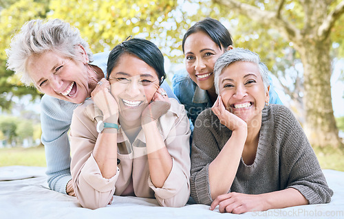 Image of Senior women and friends portrait on picnic in park for bonding, wellness and relaxing lifestyle. Happiness, joy and smile of elderly retirement people in interracial friendship in nature together.