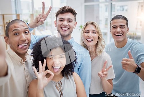 Image of Peace sign, thumbs up and selfie of business people in office. Comic face, portrait or group of friends or workers with tongue out and hand gestures, taking pictures for social media or happy memory