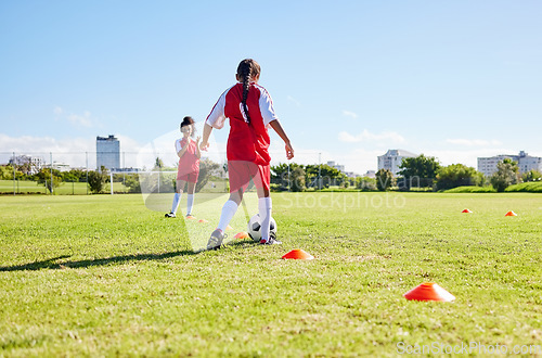 Image of Soccer, running or sports and a girl team playing with a ball together on a field for practice. Fitness, football and grass with kids training or dribbling on a pitch for competition or exercise