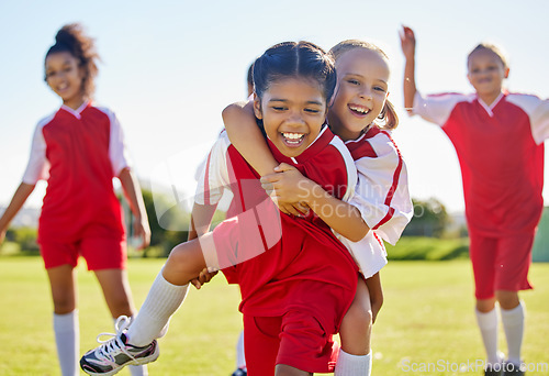 Image of Soccer, girl celebration and field with happy piggyback, team building support and solidarity for winning game. Female kids, sports diversity and celebrate with friends, teamwork and goal in football