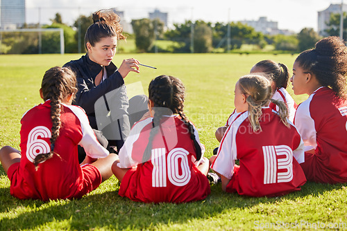 Image of Coaching, exercise or coach with children for soccer strategy, training and team goals in Canada. Team building, teamwork and woman planning group of girl on football field for game, match or workout