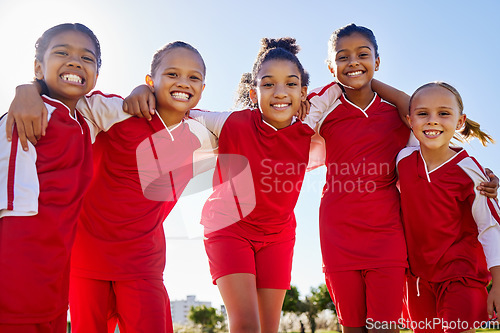 Image of Football girl, group portrait and field for smile, team building happiness and solidarity at sport training. Female kids, sports diversity and friends with teamwork, learning or soccer with low angle