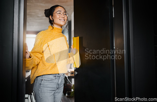 Image of Entrance, creative and Asian woman opening a door to an office at a graphic design startup company. Vision, happy and Japanese designer at a workspace with an idea, motivation and inspiration