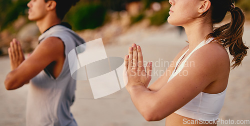 Image of Meditation, yoga and prayer hands of couple at beach outdoors for health or wellness. Zen chakra, pilates fitness or man and woman with namaste hand pose for praying, training or mindfulness exercise
