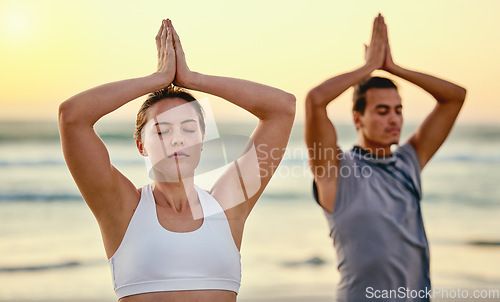 Image of Prayer hands, yoga meditation and couple at beach outdoors for health and wellness. Sunset, pilates fitness and man and woman with namaste hand pose for zen chakra, training and mindfulness exercise.