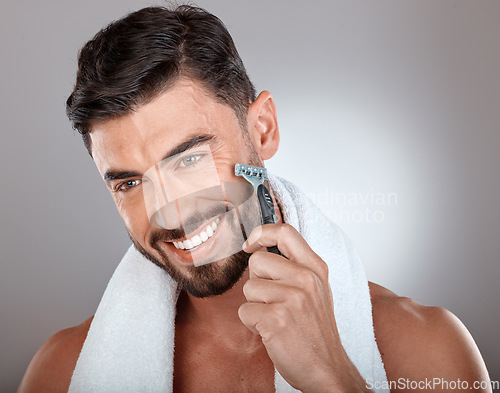Image of Razor, beauty or man in studio to shave beard with a happy smile in grooming marketing razor hair care products. Face, wellness or healthy male model shaving for skincare in routine treatment