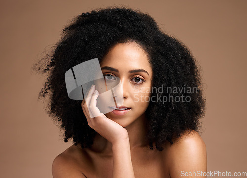 Image of Black woman, studio portrait and beauty with skincare, cosmetic glow and thinking with afro by backdrop. Model, makeup and natural hair care for aesthetic, wellness and self care by brown backdrop